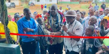 Officials and residents at ribbon-cutting ceremony for township hall project in Karluway District, Maryland County