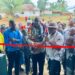 Officials and residents at ribbon-cutting ceremony for township hall project in Karluway District, Maryland County