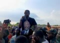Sekou Kalasco Damaro addresses crowd of supporters during petition rally in Margibi County