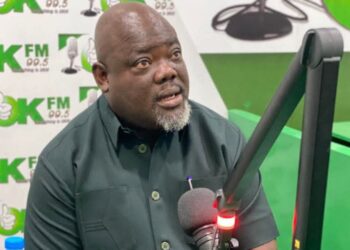 Deputy Speaker Thomas Fallah speaking during a radio interview on Okay FM