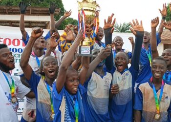 Young football players celebrate victory in Liberia U-15 inter-school league