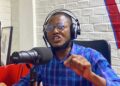 Foday Massaquoi speaking at press conference in Monrovia