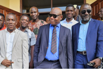 Tweah and supporters coming out of the court