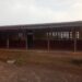 Empty classroom at Kayata Public School where students lack chairs and sit on floors in Bong County