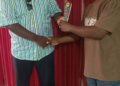 MCSS officials present award to LMHRA representative in Monrovia