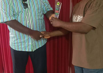 MCSS officials present award to LMHRA representative in Monrovia