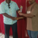 MCSS officials present award to LMHRA representative in Monrovia