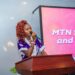 Goodness Sart speaking at an event as a rising communications professional and event host in Liberia