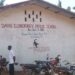 Mae Davis Public Elementary School in Bomi County where students share chairs and sit on floors due to poor conditions
