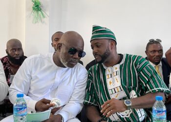 Speaker Richard Koon and Representative Prince Toles at community event discussing development and future political support