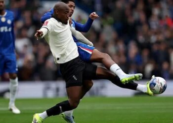 Chelsea player challenges Port Vale forward Martin Sherif during FA Cup match at Stamford Bridge