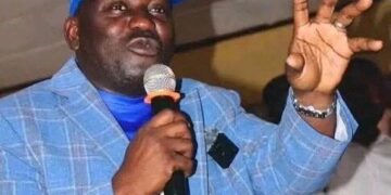Musa Hassan Bility speaking during public event in Liberia