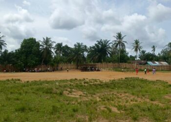 Open football field in Grand Kru County where artificial turf pitch is planned for development