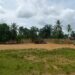 Open football field in Grand Kru County where artificial turf pitch is planned for development