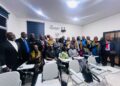 Members of Noble Second Floor and stakeholders at the dedication of a refurbished classroom at the Louis Arthur Grimes School of Law