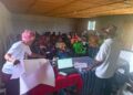 Farmers participate in hands-on vegetable production training at Sankofa Farm in Bong County, Liberia