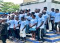 Graduates of the Waves for Change and Arise From Ashes surf therapy and youth empowerment program gather in Harper City, Maryland County