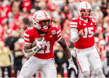 Emmett Johnson in action during a college football game before being drafted by the Kansas City Chiefs