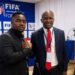 Cassell Kuoh standing with LFA President Mustapha Raji during a football event in Liberia