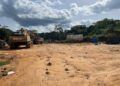 Heavy mining equipment sits at a remote mining site linked to illegal mining activities and environmental destruction in Liberia.