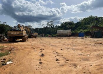 Heavy mining equipment sits at a remote mining site linked to illegal mining activities and environmental destruction in Liberia.