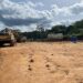 Heavy mining equipment sits at a remote mining site linked to illegal mining activities and environmental destruction in Liberia.