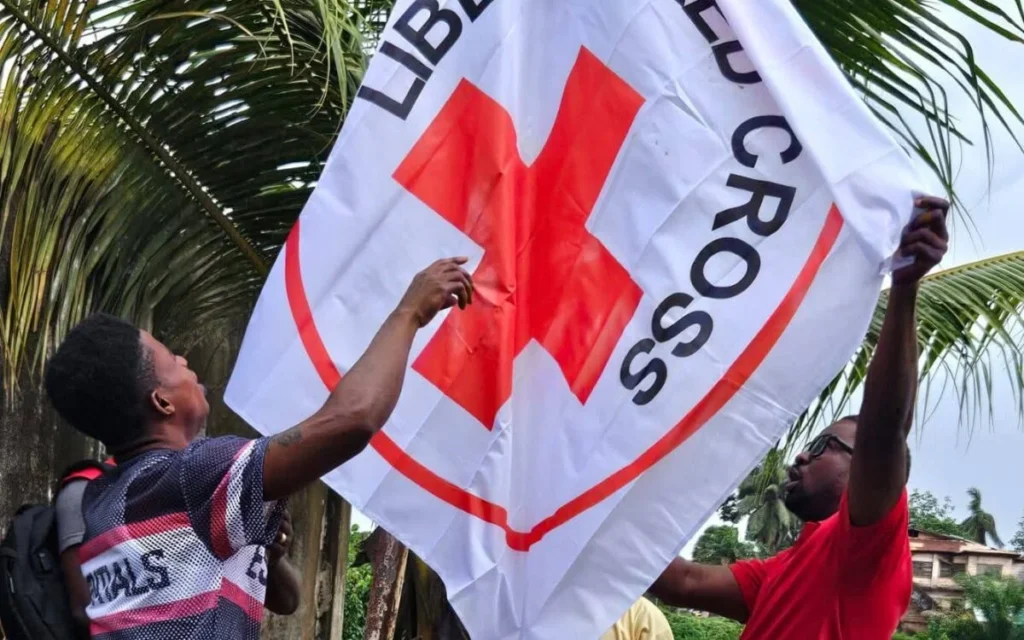 Liberia National Red Cross flag being hoisted