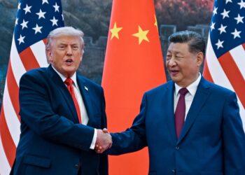 Chinese President Xi Jinping shakes hands with U.S. President Donald Trump during summit talks in Beijing