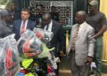 Liberian officials and U.S. representatives inspect donated motorbikes intended to strengthen anti-drug operations in rural counties.