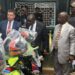 Liberian officials and U.S. representatives inspect donated motorbikes intended to strengthen anti-drug operations in rural counties.