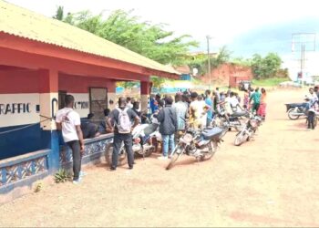 Motorcyclists gathered outside Gbarnga police station amid investigation into detainee death