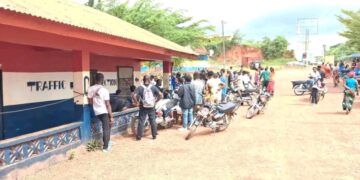 Motorcyclists gathered outside Gbarnga police station amid investigation into detainee death