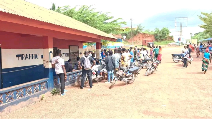 Motorcyclists gathered outside Gbarnga police station amid investigation into detainee death