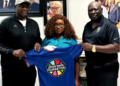 Youth and Sports Minister Cornelia Kruah poses with members of the FIBA Zone-3 delegation and Jordan Nwora Foundation representatives in Paynesville