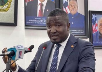 Deputy Minister Daniel O. Sando speaks at press briefing criticizing former President George Weah