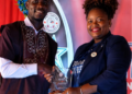 FeJAL President Lisa Diasay presents an award during the District 11 Students Union academic awards ceremony in Monrovia.