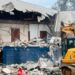 Excavator demolishes the former CDC headquarters building in Monrovia amid ongoing legal disputes over the disputed property