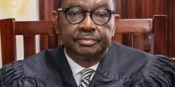 Liberia Justice Minister Oswald Tweh during a press conference in Monrovia