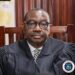Liberia Justice Minister Oswald Tweh during a press conference in Monrovia