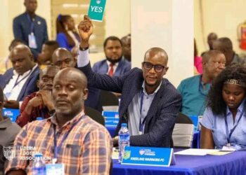 Liberia Football Association congress delegate voting during an LFA meeting