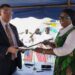 Liberian Foreign Minister Sara Beysolow Nyanti and a U.S. diplomat signing the Shiprider Agreement at the Liberia Coast Guard Base