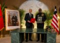 Liberian and Moroccan officials pose with signed documents during a diplomatic meeting focused on bilateral cooperation and security relations.