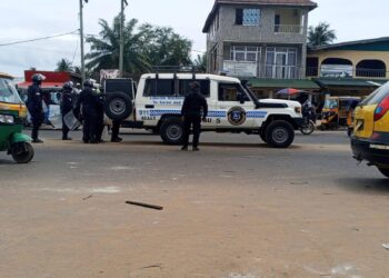 Liberia National Police officers responding to unrest in Gardnersville following a confrontation with residents.