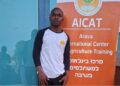 Liberian journalist and agriculture student Josiah Pailay standing at the Arava International Center for Agricultural Training in Israel.
