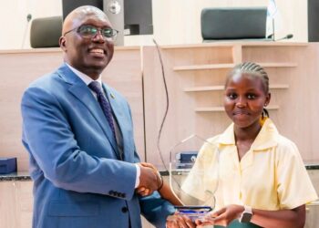 A Liberian student receives an award after winning the Regional Intellectual Property High School Club Competition in Harare, Zimbabwe.