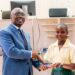 A Liberian student receives an award after winning the Regional Intellectual Property High School Club Competition in Harare, Zimbabwe.