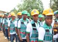 Graduates of River Gee Technical College wearing safety helmets and technical training uniforms during activities linked to the institution's first commencement program.