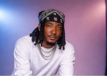 Liberian musician AD King performing on stage