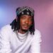 Liberian musician AD King performing on stage