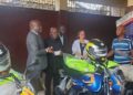 Officials from the United Nations, European Union and INCHR inspect newly donated motorcycles and equipment during a handover ceremony in Monrovia.